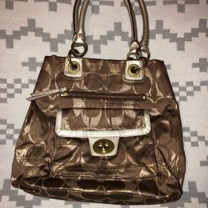 Coach gold and brown purse.